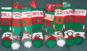 family stockings, with tree, candles, and wreath