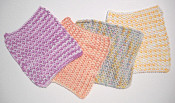 knitted dishcloths in lighter variegated colors